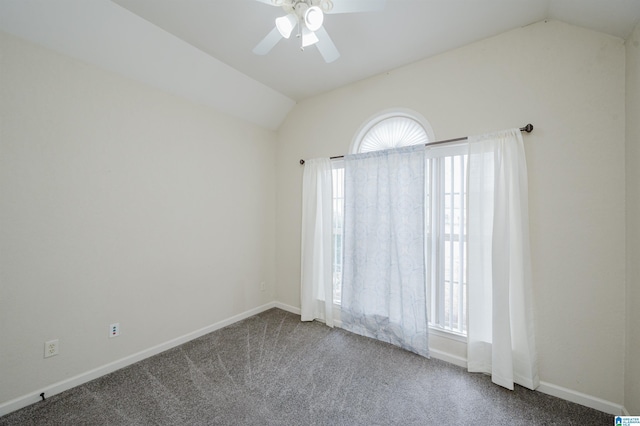 carpeted empty room with lofted ceiling, plenty of natural light, baseboards, and a ceiling fan