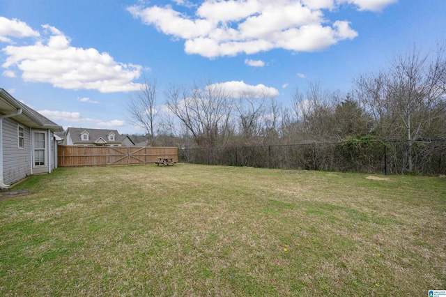 view of yard with a fenced backyard