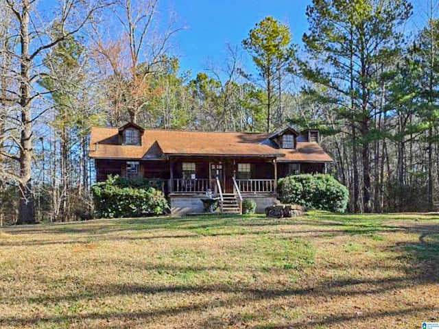 view of front facade with a porch and a front lawn