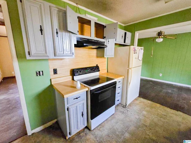 kitchen with range with electric cooktop, freestanding refrigerator, extractor fan, light countertops, and backsplash