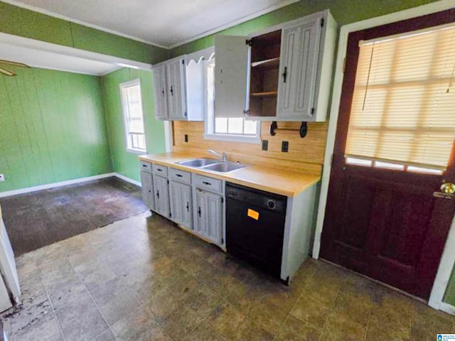 kitchen with dishwasher, backsplash, light countertops, open shelves, and a sink