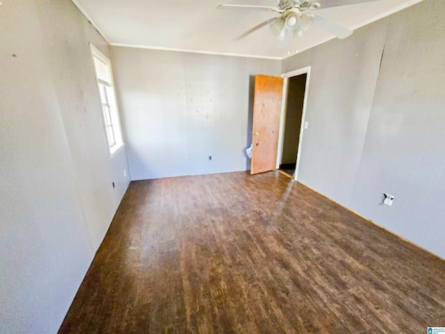 spare room with ceiling fan and wood finished floors