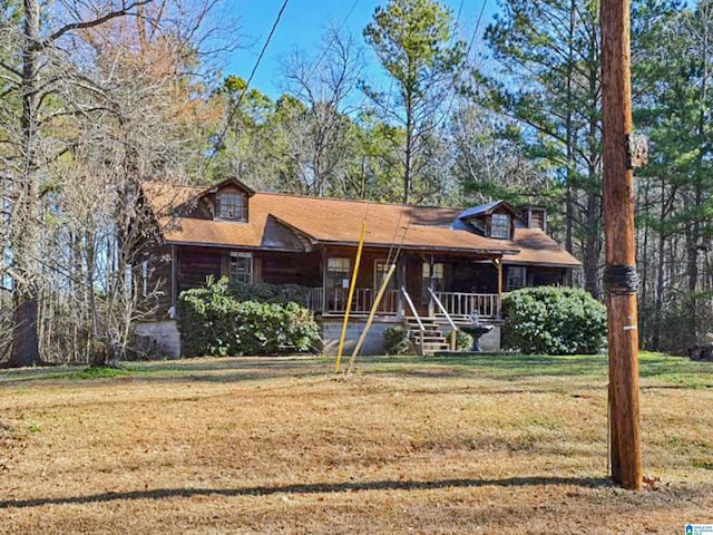 view of front of property with a front yard and covered porch