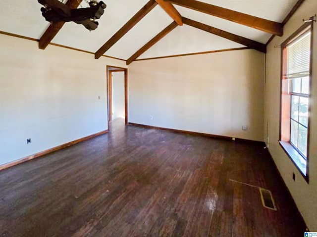 empty room featuring visible vents, baseboards, wood finished floors, and beamed ceiling