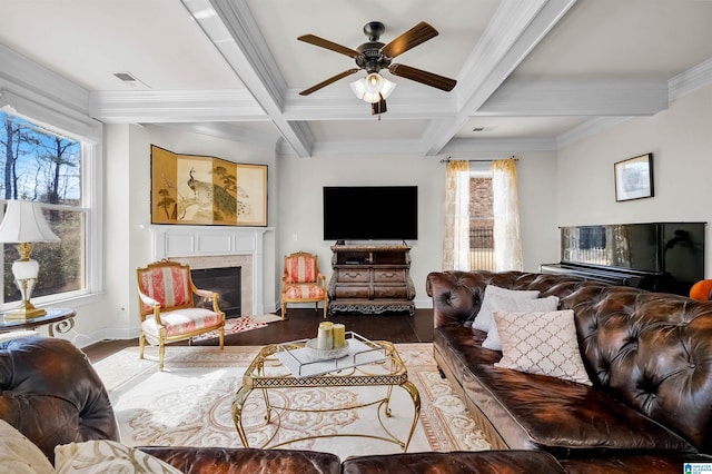 living room with a premium fireplace, beamed ceiling, coffered ceiling, and wood finished floors