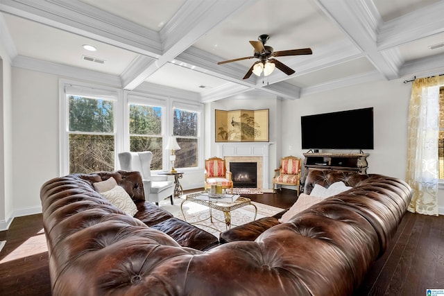 living room with plenty of natural light, beam ceiling, coffered ceiling, and hardwood / wood-style floors