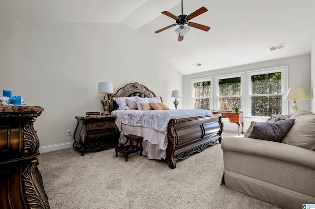 carpeted bedroom with lofted ceiling, a ceiling fan, visible vents, and baseboards