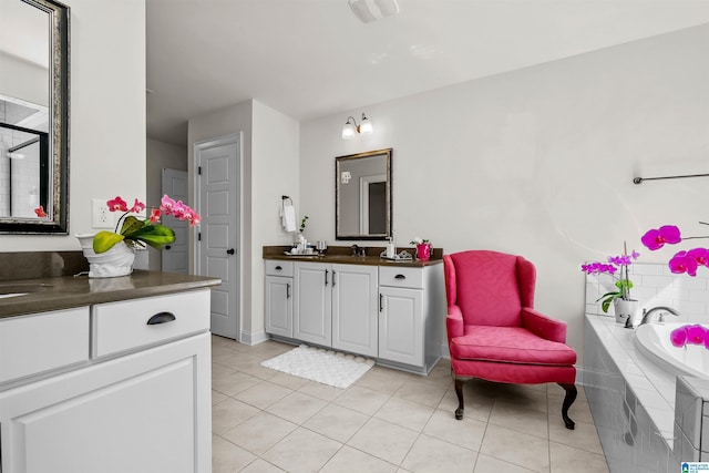 bathroom with a bath, a shower with door, vanity, and tile patterned floors