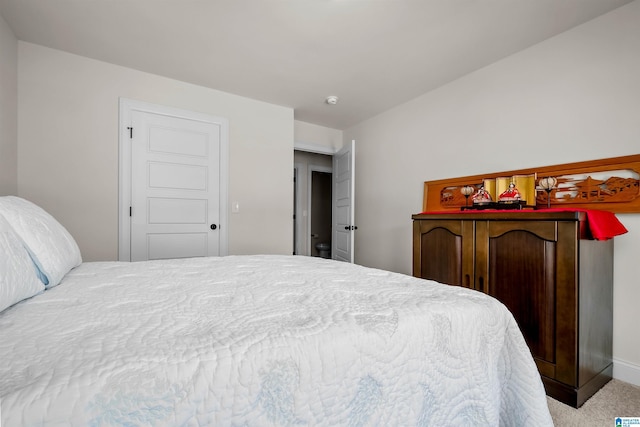 carpeted bedroom with baseboards