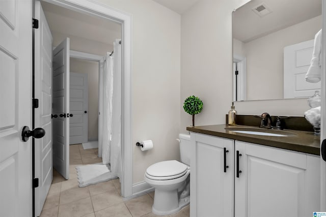 full bathroom with visible vents, toilet, curtained shower, tile patterned flooring, and vanity