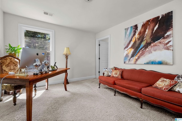 carpeted home office with visible vents and baseboards