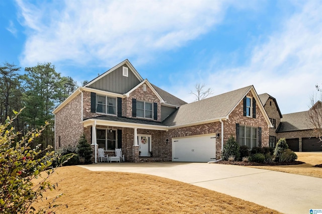 craftsman inspired home featuring brick siding, concrete driveway, board and batten siding, a garage, and a front lawn