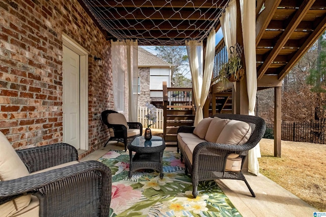 view of patio / terrace with stairs, an outdoor hangout area, and fence