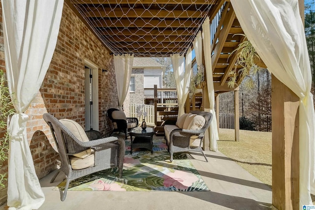 view of patio / terrace with stairway and an outdoor living space