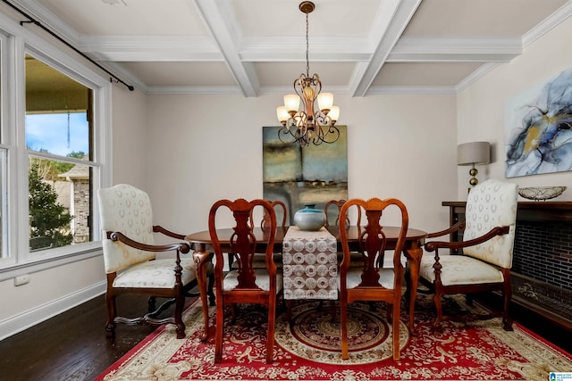 sitting room with beam ceiling, wood finished floors, a chandelier, coffered ceiling, and baseboards