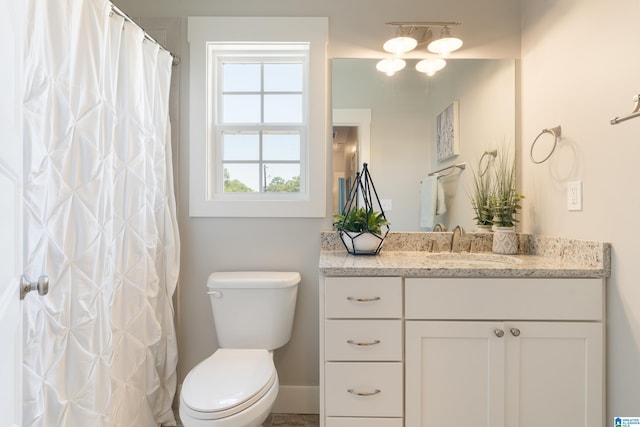 full bathroom with vanity and toilet