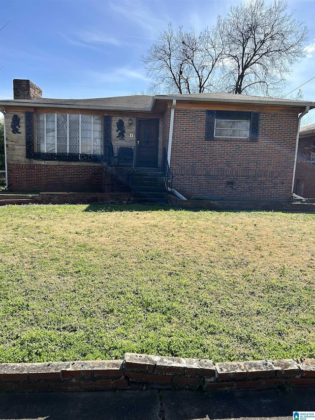 ranch-style home featuring a chimney, brick siding, crawl space, and a front yard