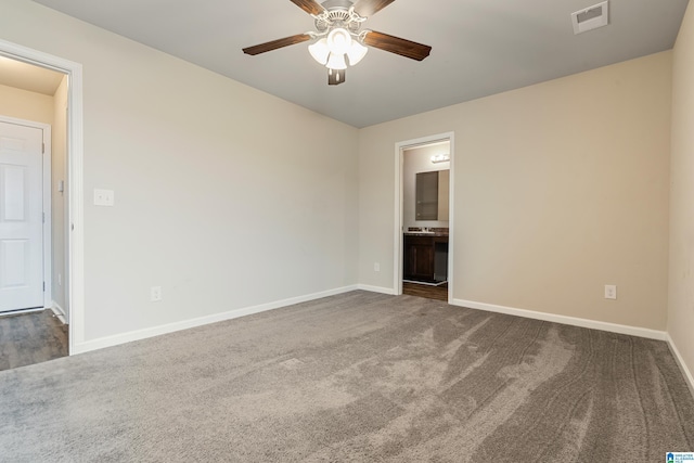 unfurnished room featuring ceiling fan, carpet floors, visible vents, and baseboards