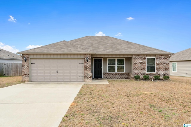 ranch-style house with an attached garage, driveway, a front yard, and brick siding