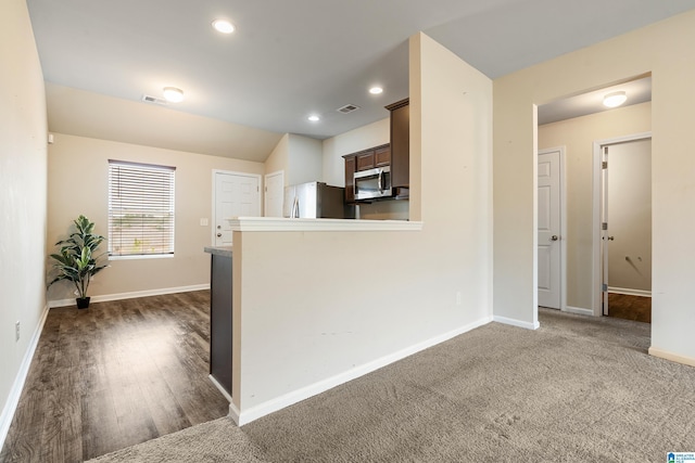 kitchen with dark brown cabinetry, baseboards, visible vents, stainless steel appliances, and recessed lighting