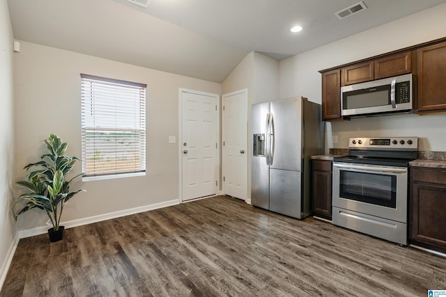 kitchen with stainless steel appliances, visible vents, baseboards, and dark wood-style floors