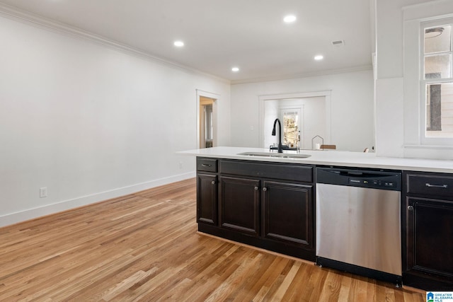 kitchen with ornamental molding, a sink, light wood-style floors, light countertops, and dishwasher