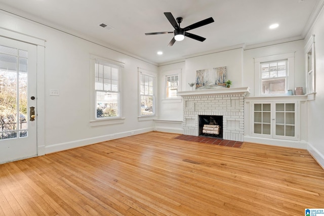 unfurnished living room with visible vents, crown molding, ceiling fan, and hardwood / wood-style floors