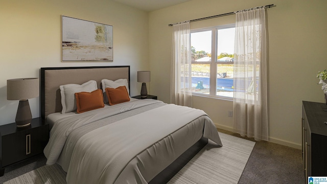 bedroom featuring multiple windows and baseboards