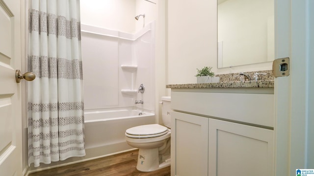 full bathroom with wood finished floors, vanity, toilet, and shower / bathtub combination with curtain