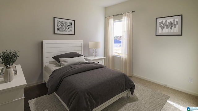 bedroom with carpet floors and baseboards