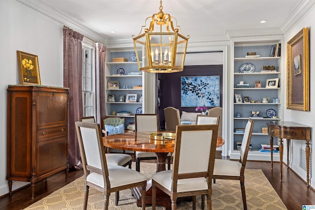 dining room with crown molding, dark wood-style flooring, built in features, and a notable chandelier