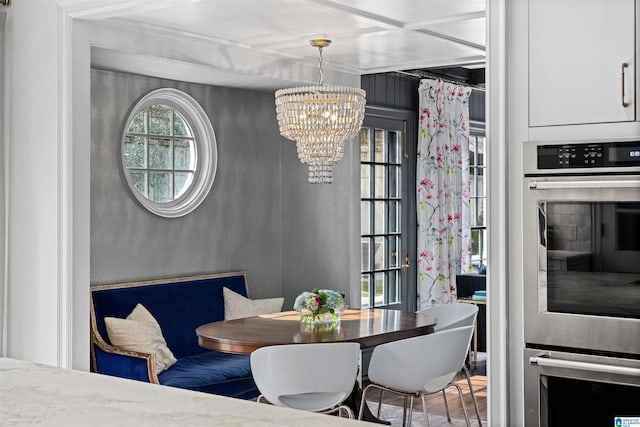 dining space featuring an inviting chandelier