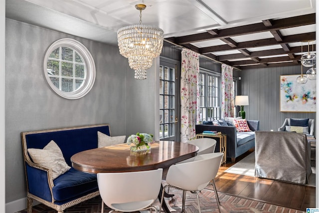 dining room featuring plenty of natural light, wood-type flooring, coffered ceiling, and a chandelier