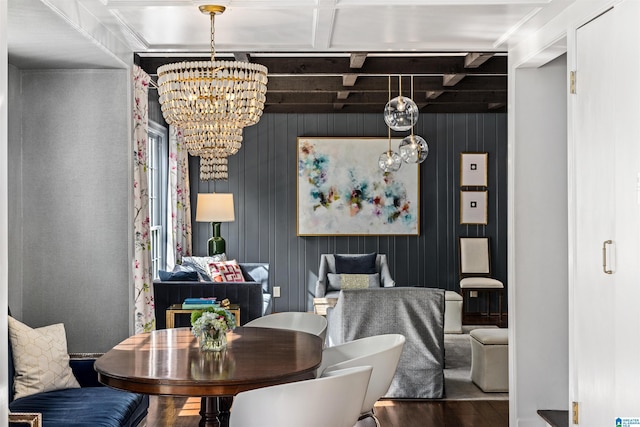 dining area with a chandelier and wood finished floors