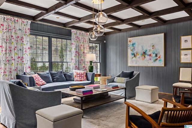 living room featuring plenty of natural light, coffered ceiling, and beamed ceiling