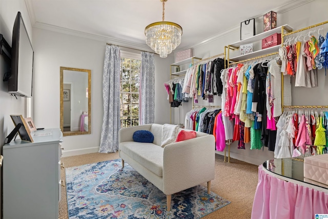 walk in closet with carpet floors and a chandelier