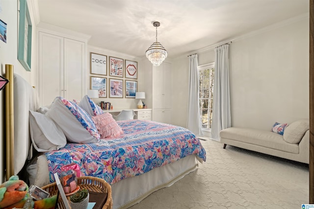 carpeted bedroom featuring an inviting chandelier and crown molding