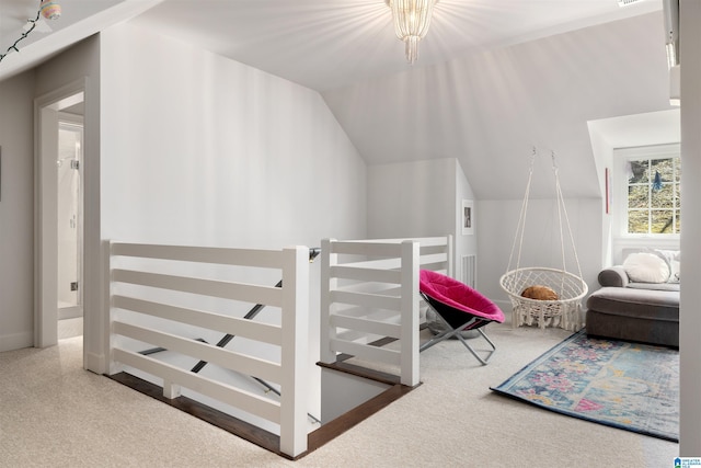 bedroom with lofted ceiling and carpet flooring