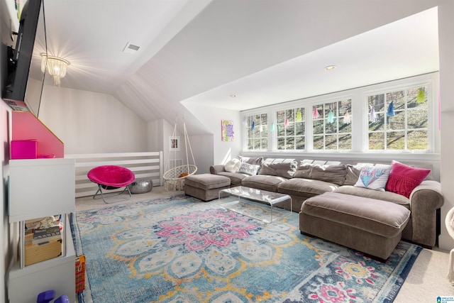 living area featuring lofted ceiling and carpet