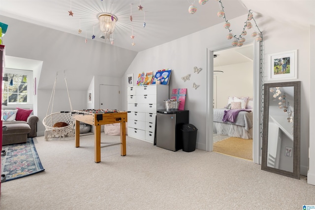 playroom featuring lofted ceiling and carpet flooring