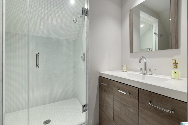 full bathroom featuring a stall shower and vanity