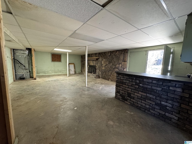 basement featuring a paneled ceiling