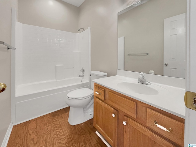 full bath featuring shower / tub combination, vanity, toilet, and wood finished floors