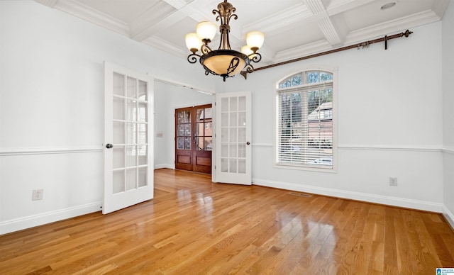 unfurnished dining area with light wood finished floors, french doors, and baseboards