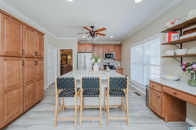 kitchen with a breakfast bar area, open shelves, light countertops, appliances with stainless steel finishes, and ornamental molding