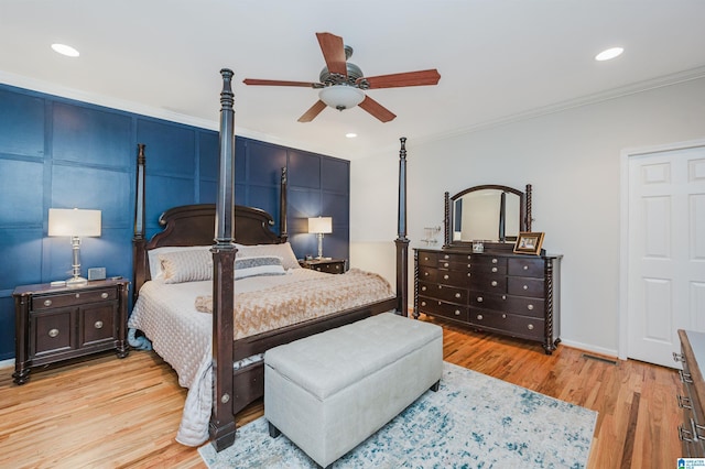 bedroom with recessed lighting, light wood-style floors, ornamental molding, a ceiling fan, and baseboards