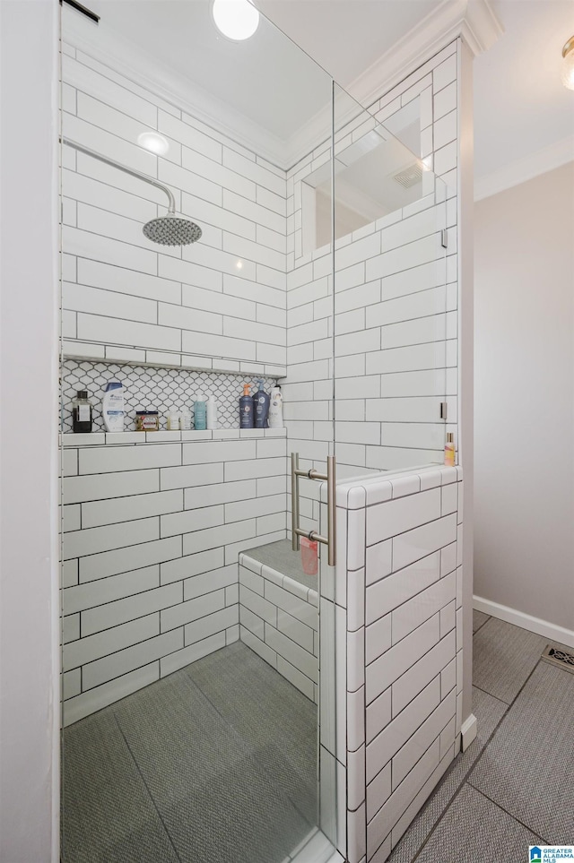 full bathroom with ornamental molding, a stall shower, and baseboards