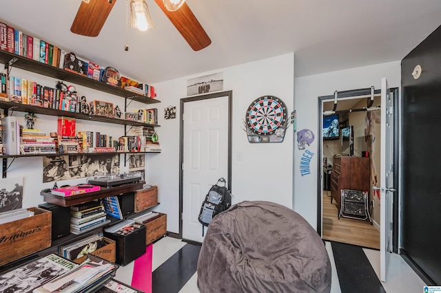 living area with ceiling fan