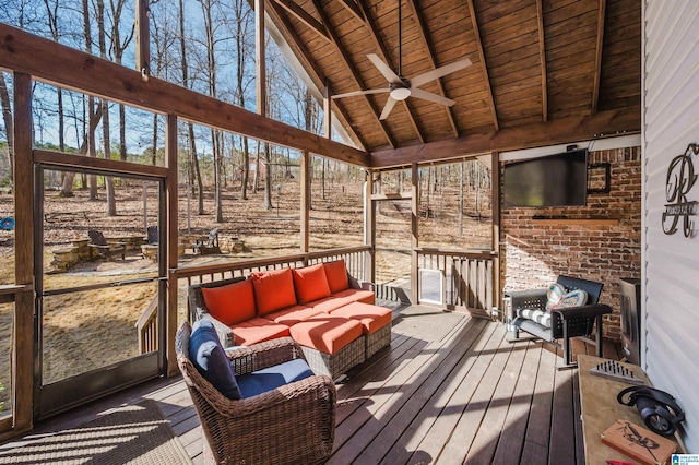 sunroom / solarium featuring wood ceiling, ceiling fan, and lofted ceiling with beams