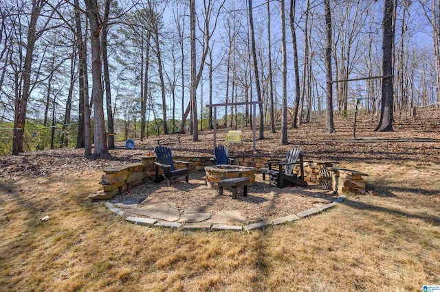 view of yard featuring a fire pit